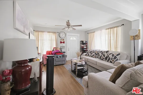 a living room with furniture and a large window