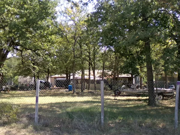 a view of outdoor space with deck and tree