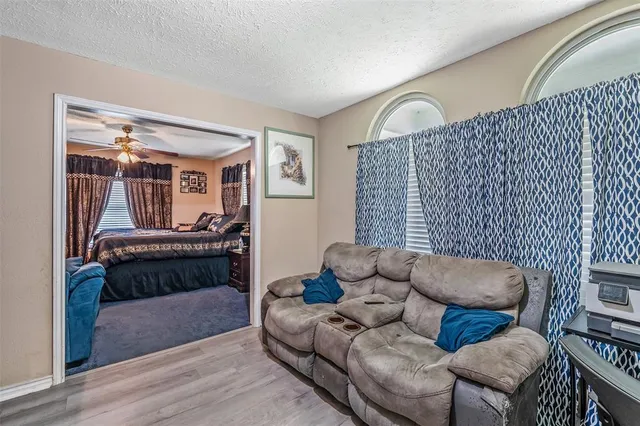 a living room with furniture and a window