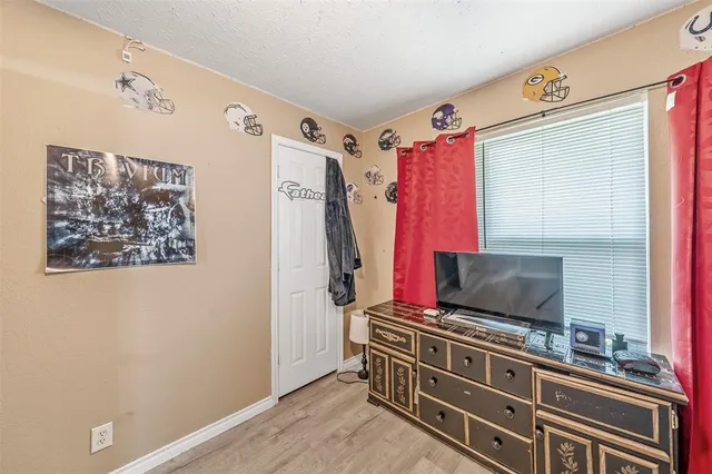 a room with furniture and a flat screen tv