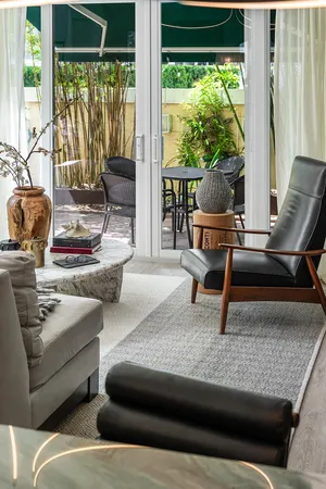 a living room with furniture a fireplace and a table