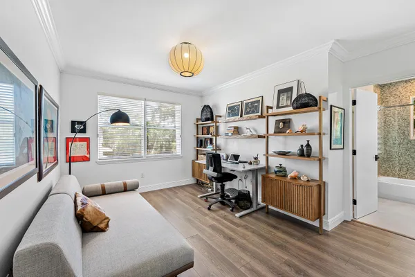 a bedroom with furniture and a window
