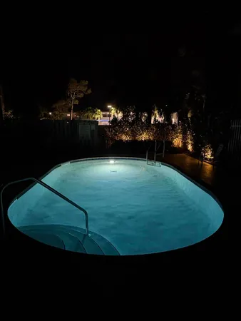 a view of a swimming pool with an outdoor space and seating area