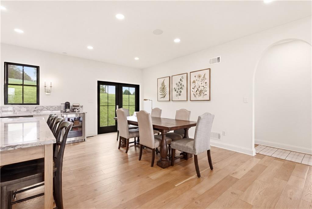 315 Stewarton Road Mill Run, PA 15464 - Photo 11 of 47 a view of a dining room with furniture and wooden floor