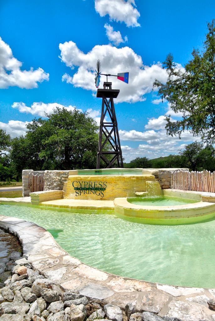 128 Cranbrook Court Ingram, TX 78025 - Photo 6 of 19 a view of a swimming pool with a yard
