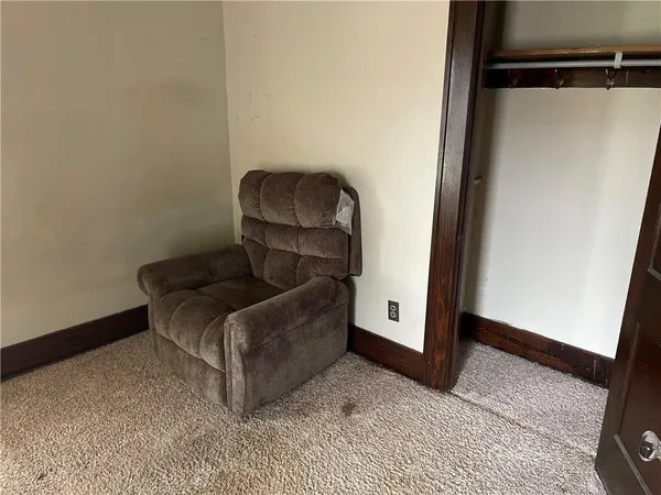 a living room with furniture and a gate
