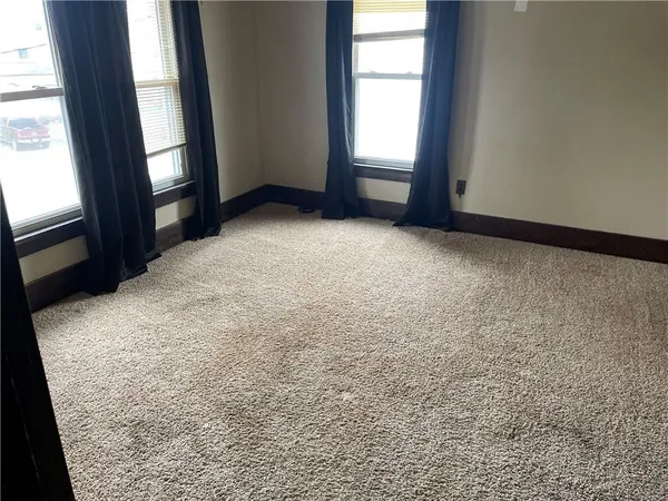 a room with gym equipment and a window