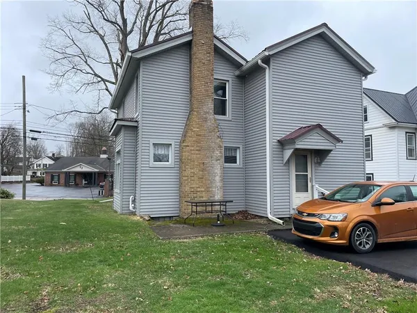 a view of a house with a car park