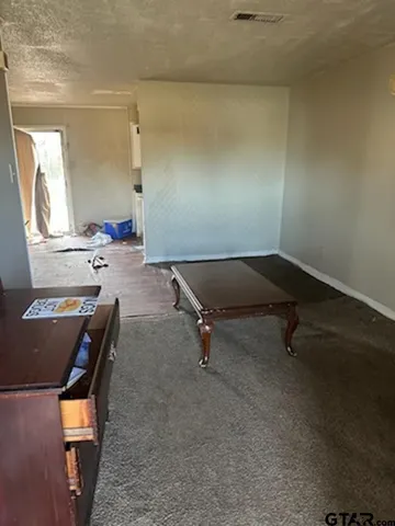 a room with a table and chairs