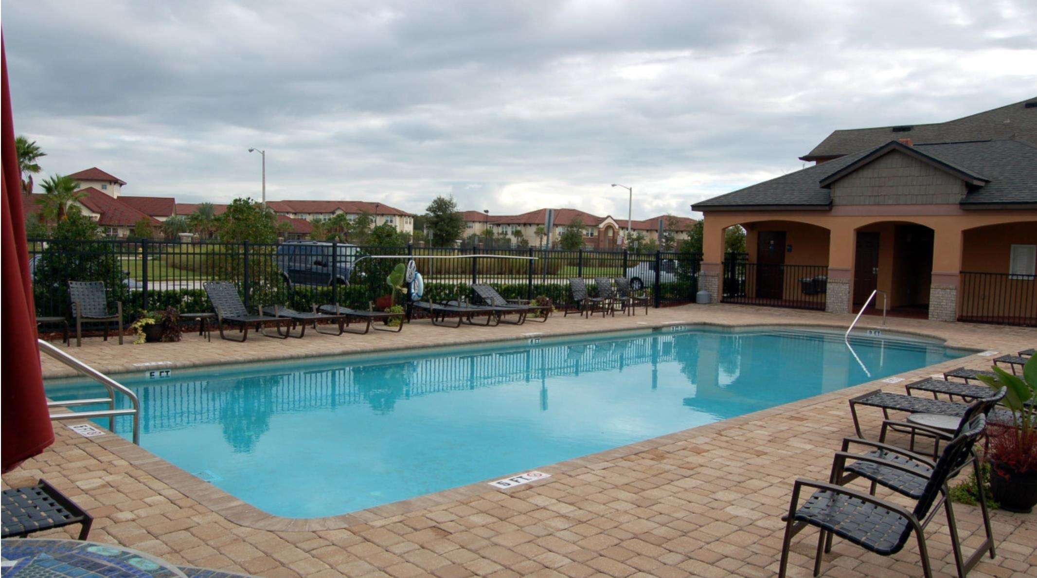 441 Cabernet Place St. Augustine, FL 32084 - Photo 2 of 16 a view of a swimming pool with a patio and a yard