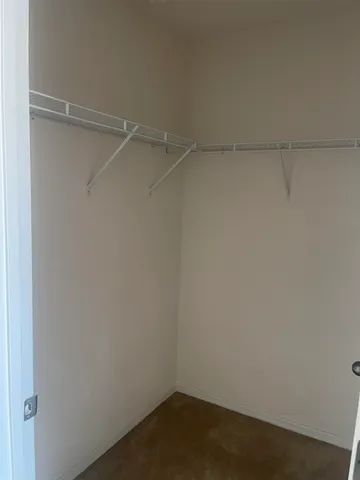 a white toilet sitting next to a bath tub