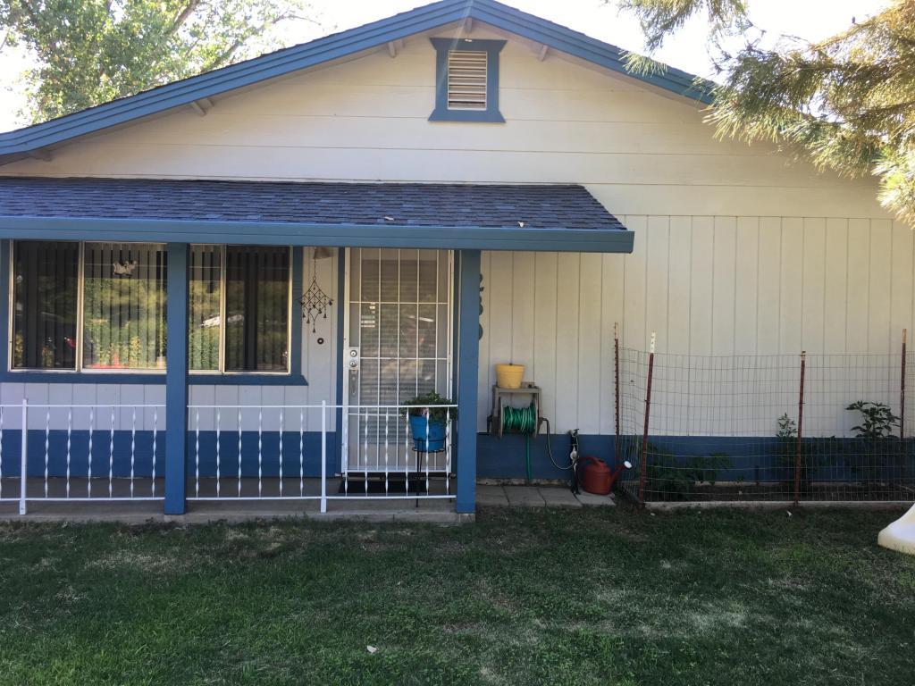 2801 Henderson Road Redding, CA 96002 - Photo 1 of 26 a front view of a house with garden