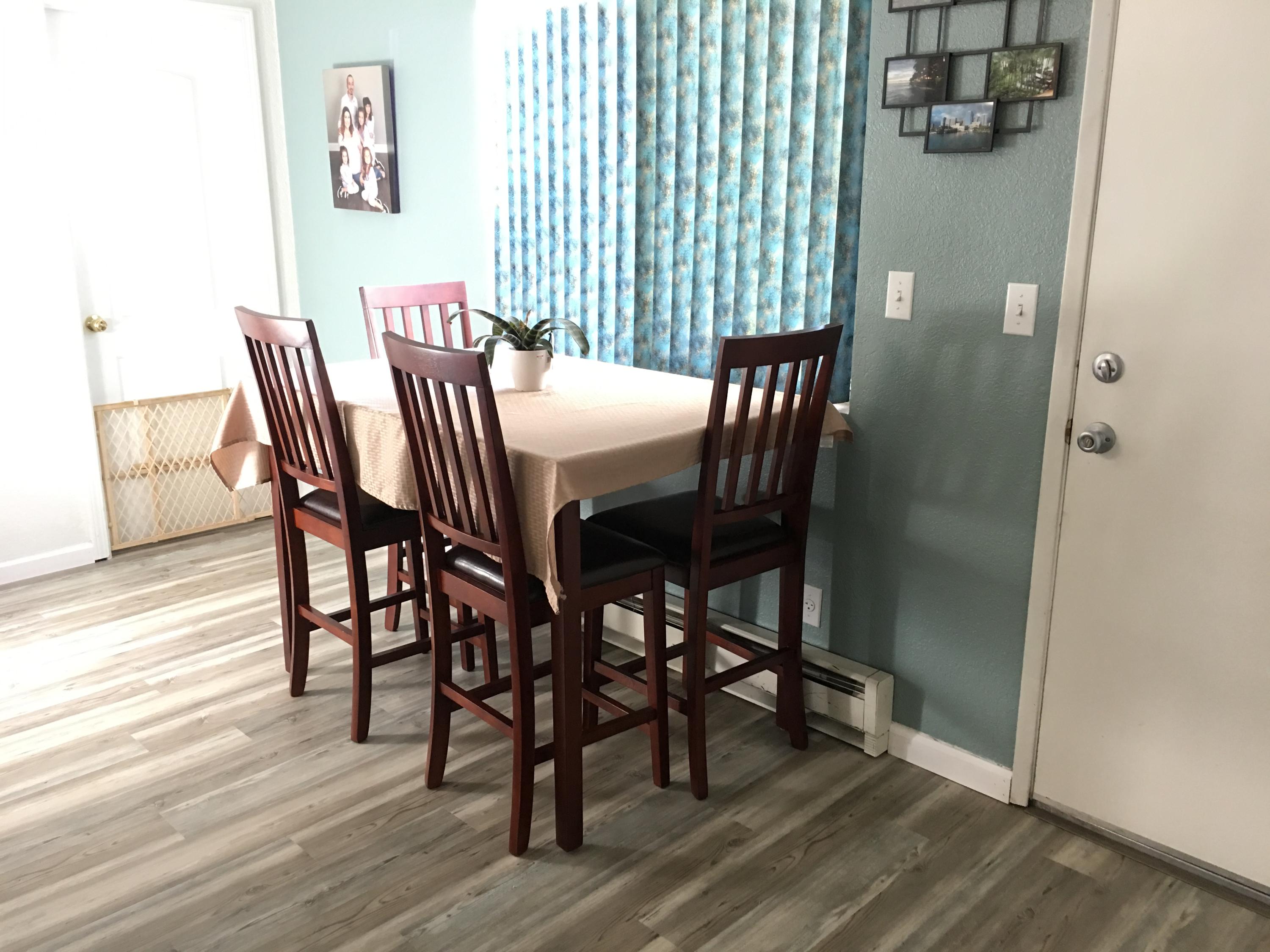2801 Henderson Road Redding, CA 96002 - Photo 11 of 26 a view of a dining room with furniture and wooden floor