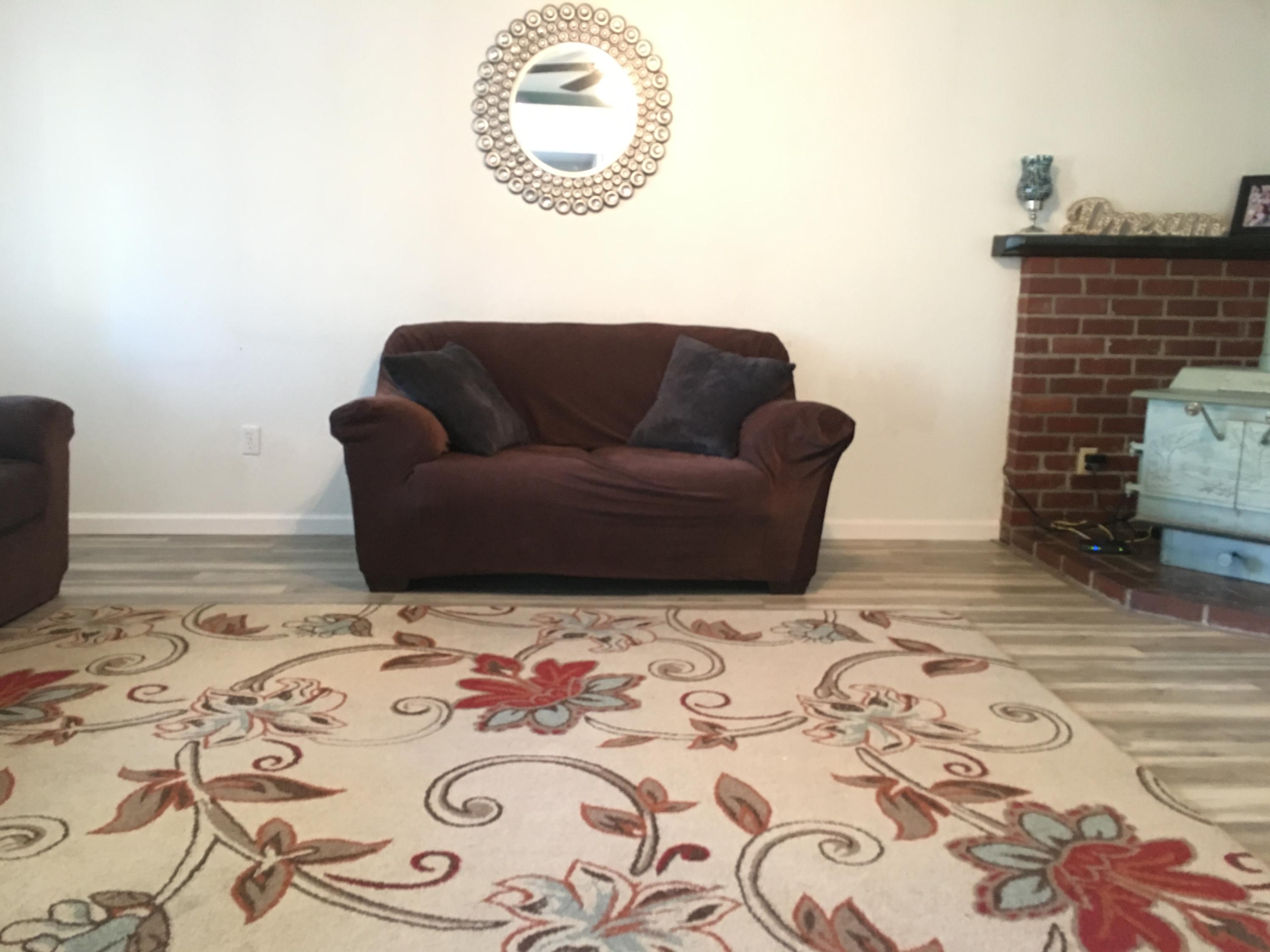 2801 Henderson Road Redding, CA 96002 - Photo 6 of 26 a view of a livingroom with wooden floor and a rug