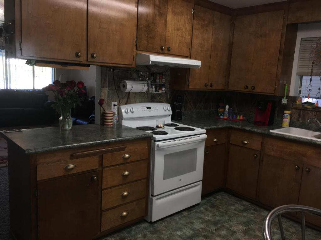 2801 Henderson Road Redding, CA 96002 - Photo 8 of 26 a kitchen with a sink and cabinets