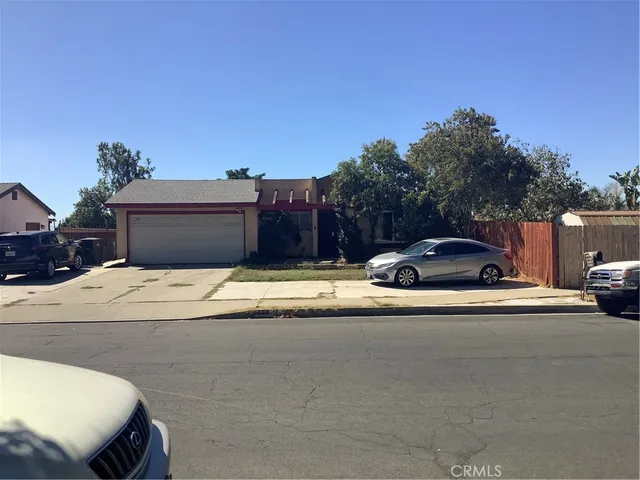 a view of a car parked in front of a house