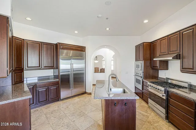 a view of a dining room with furniture and window