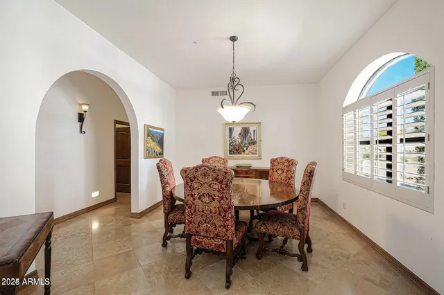a reading room with furniture and a rug