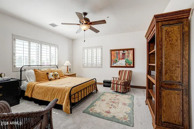 a bedroom with a bed furniture and window