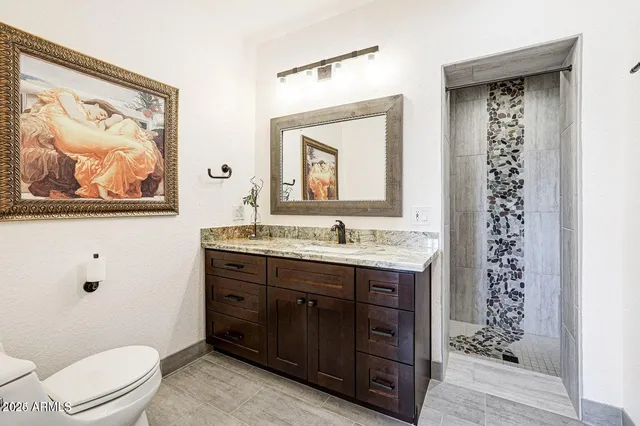 a kitchen with a refrigerator sink and cabinets
