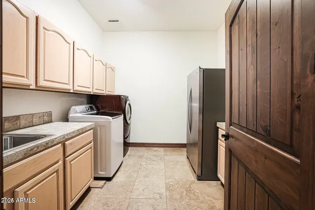 a bathroom with a granite countertop toilet sink and mirror