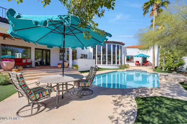 a view of a house with a yard porch and sitting area