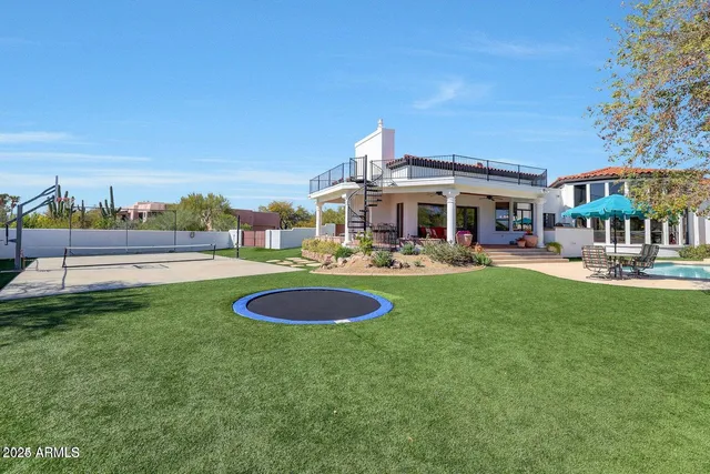a view of a balcony with mountain view and wooden floor