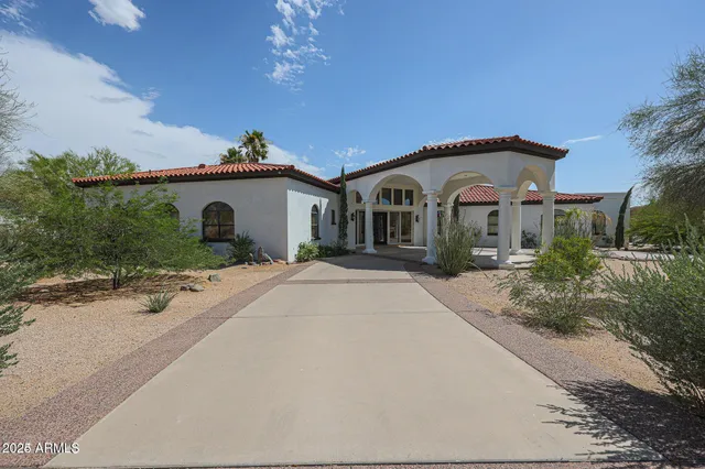 a view of living room filled with furniture and a window