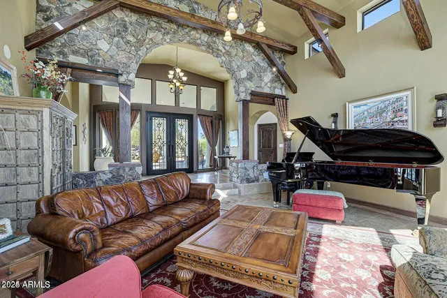 a living room with furniture flat screen tv and a fireplace