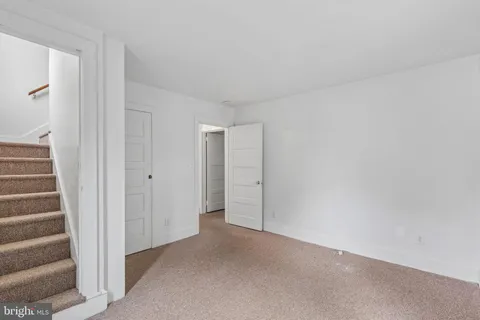 a view of an empty room with a fireplace