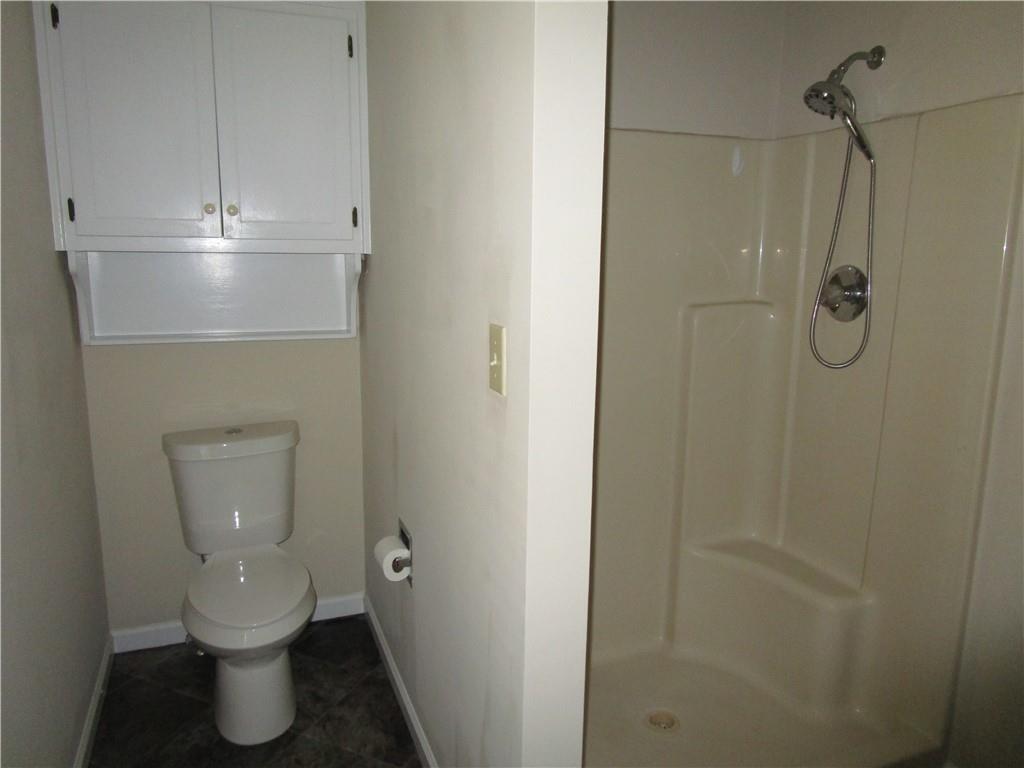 2429 Thompson Mill Road Gainesville, GA 30506 - Photo 25 of 52 a bathroom with a toilet and a shower