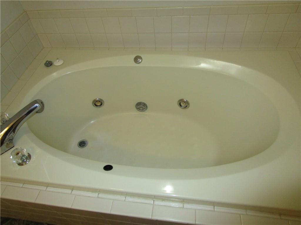 2429 Thompson Mill Road Gainesville, GA 30506 - Photo 27 of 52 a bathroom with a tub