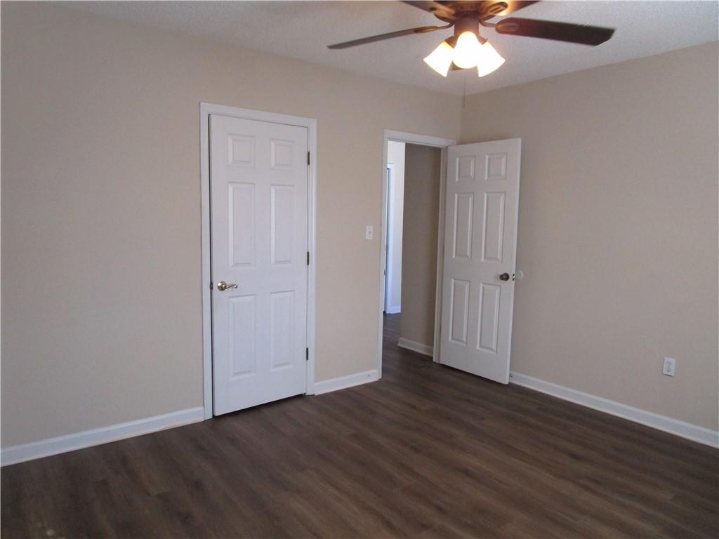 2429 Thompson Mill Road Gainesville, GA 30506 - Photo 33 of 52 a view of an empty room with wooden floor