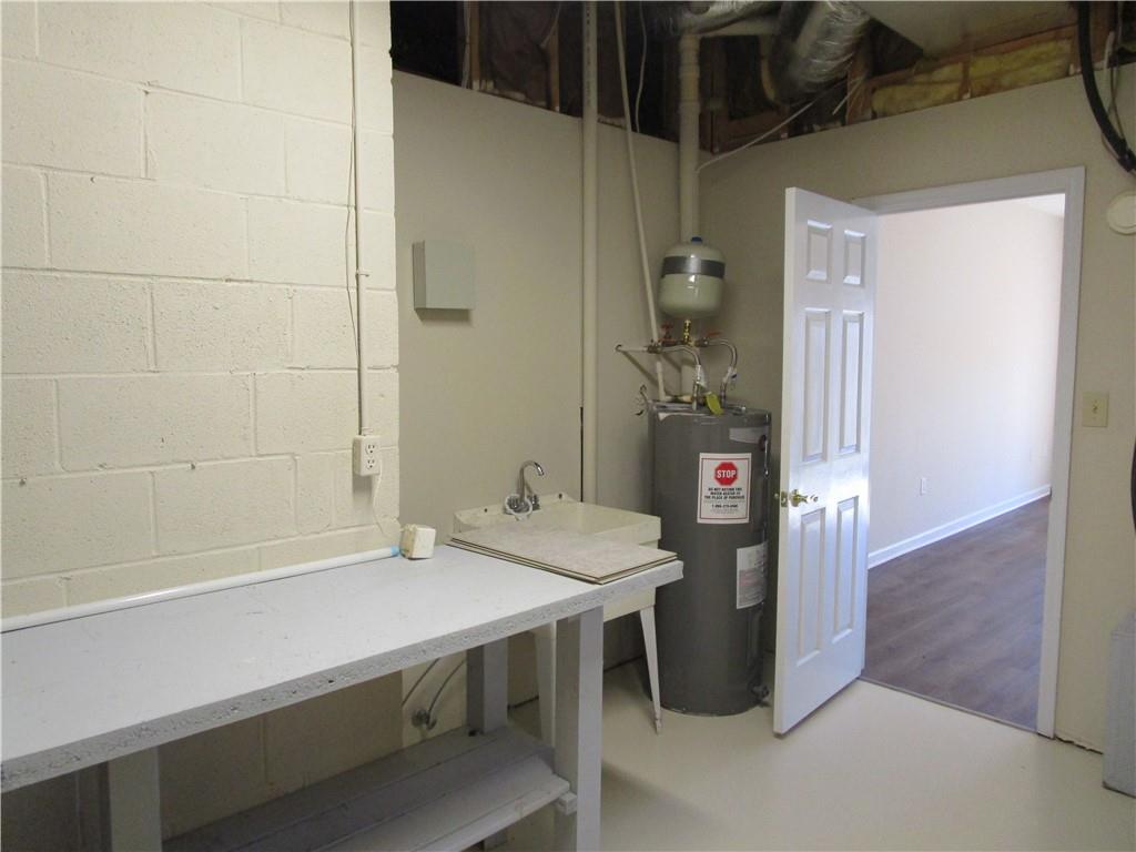 2429 Thompson Mill Road Gainesville, GA 30506 - Photo 43 of 52 a bathroom with a sink and a mirror