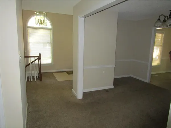 a view of hallway with windows