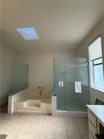a bathroom with a tub and a shower