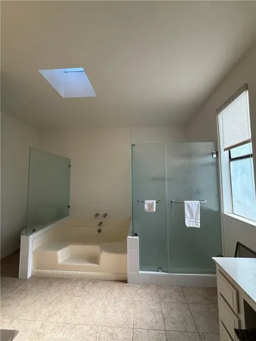 a bathroom with a tub and a shower