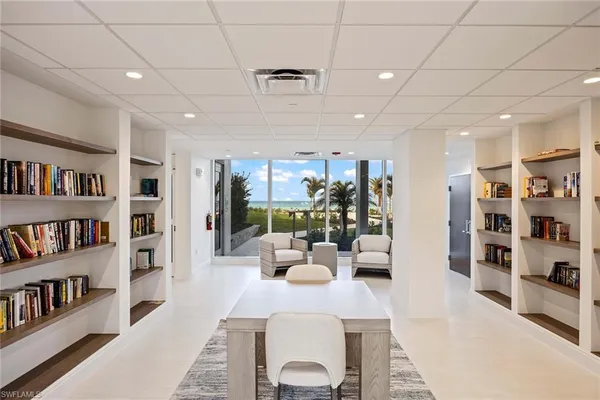 a view of a building with garden and sitting area