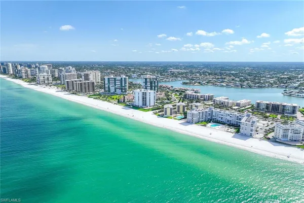 a view of a swimming pool with a yard