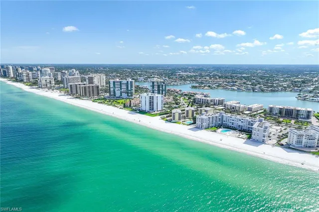 a view of a swimming pool with a yard