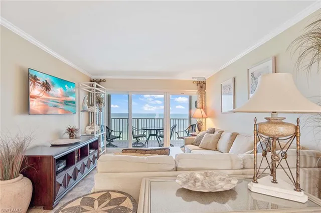 a living room with furniture and white walls