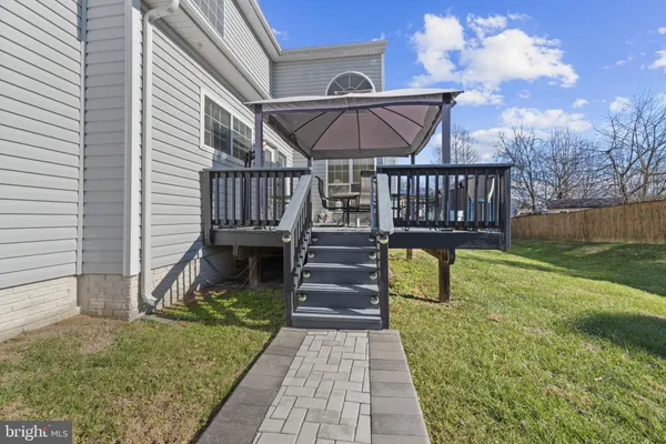 a view of a backyard with plants and a patio