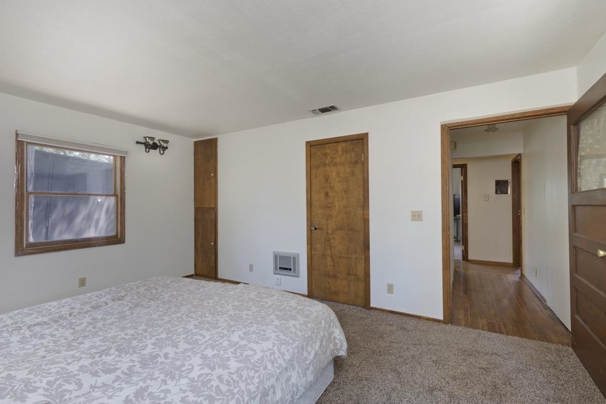2030 Old Mammoth Road Mammoth Lakes, CA 93546 - Photo 22 of 46 a bedroom with a bed and a painting on the wall