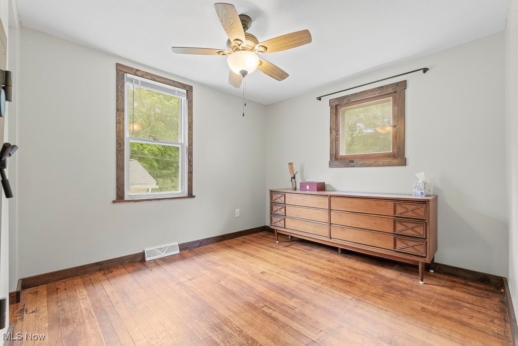 282 Johnson Road Wadsworth, OH 44281 - Photo 17 of 50 Unfurnished bedroom featuring ceiling fan and wood-type flooring