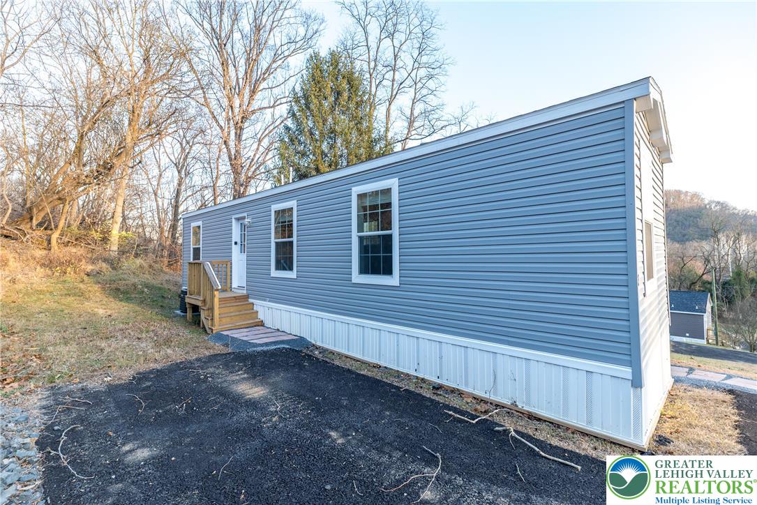 465 Royal Manor Road, Unit LOT 3 Easton, PA 18042 - Photo 14 of 15 a view of a backyard with a large tree