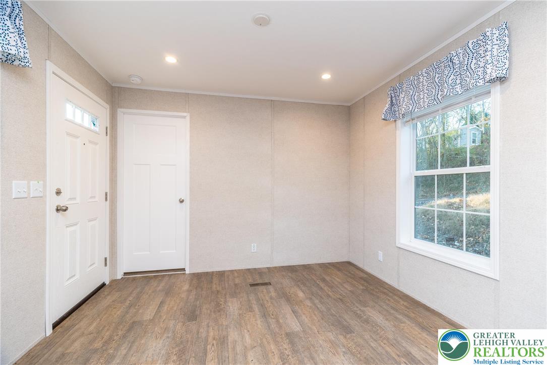 465 Royal Manor Road, Unit LOT 3 Easton, PA 18042 - Photo 5 of 15 an empty room with wooden floor and windows