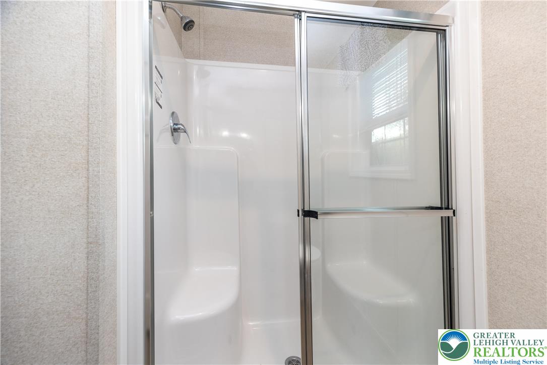 465 Royal Manor Road, Unit LOT 3 Easton, PA 18042 - Photo 10 of 15 a bathroom with a glass shower door