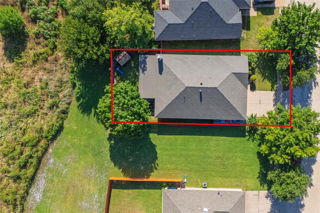 4025 Chisos Rim Trail Fort Worth, TX 76244 - Photo 4 of 40 Aerial property overview featuring a dark-shingled roof and an attached concrete driveway