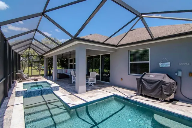 a living room with furniture and a book shelf