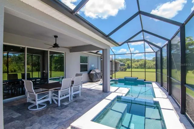 a view of walk in closet with clothes